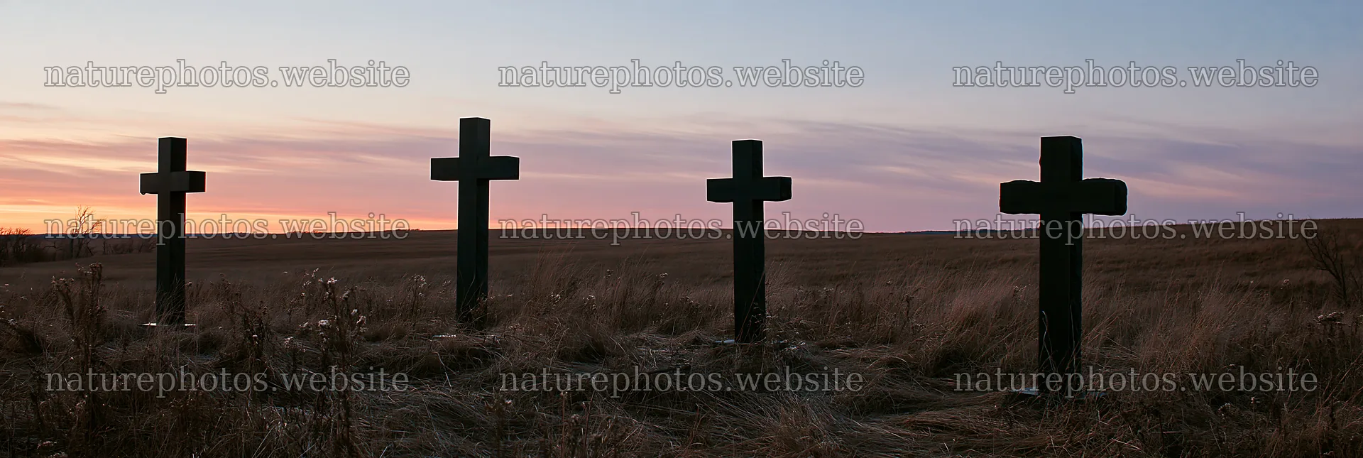 Four Christian crosses in a winter meadow at sunset – nature photos 13690x4602