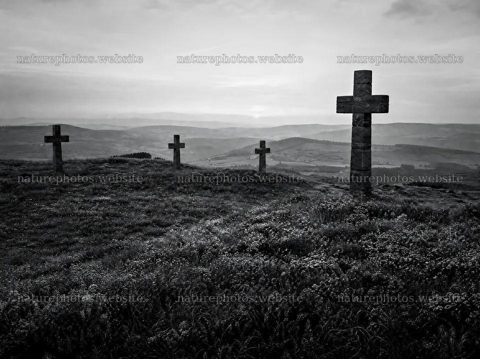 Christian crosses on a rolling meadow with sunrise light – nature photos 9186x6858