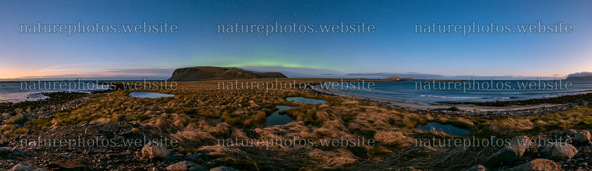 Aurora lights over meadow and coast during sunset – nature photos 14762x4268