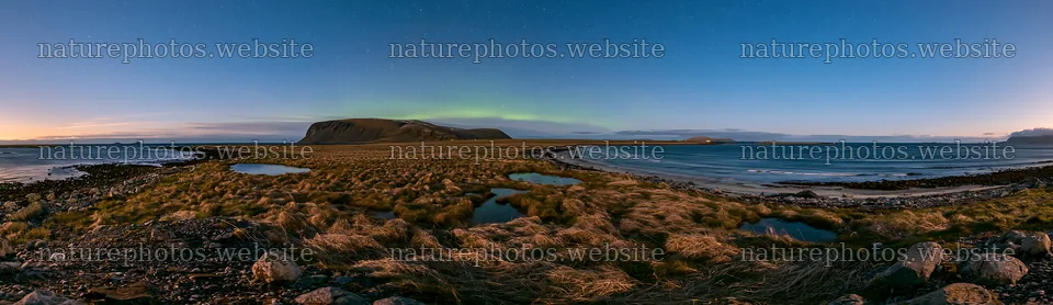 Aurora lights over meadow and coast during sunset – nature photos 14762x4268