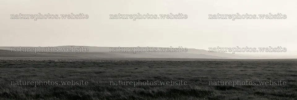 Cloudy limestone meadow at dawn with distant hills – nature photos 13690x4602